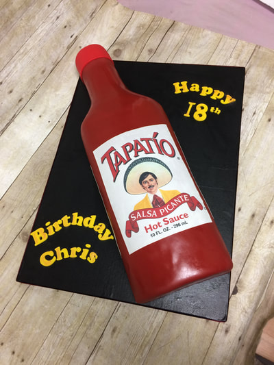 18th birthday cake in the shape of a Tapati'o bottle.
Click here for larger image.