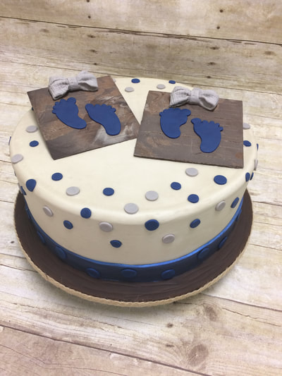 baby shower cake, single tier with blue and grey dots.
